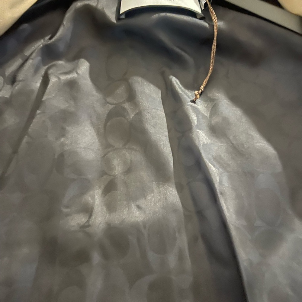 I am listing a men’s Coach trench coat size large - Picture 8 of 10